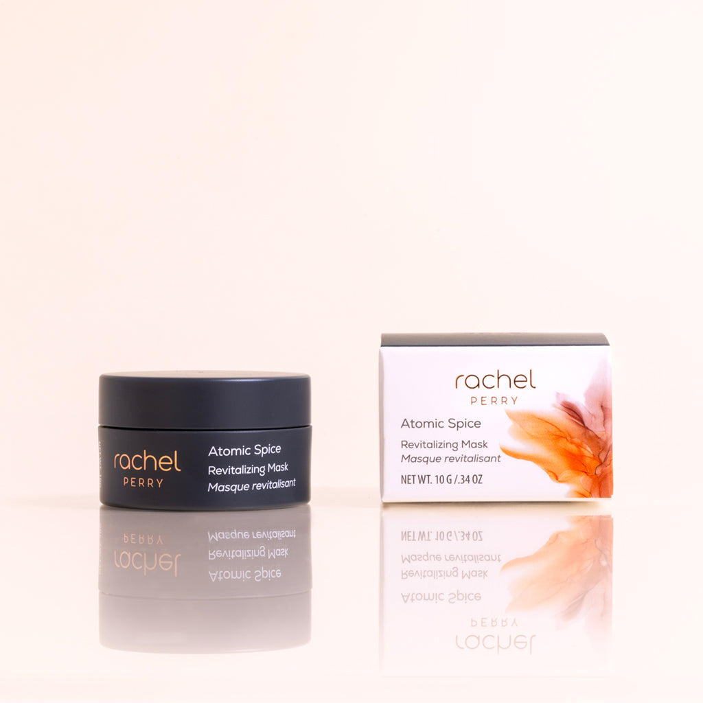 Jar of vegan natural skincare 'Atomic Spice Revitalizing Mask' by Rachel Perry on a light beige background
