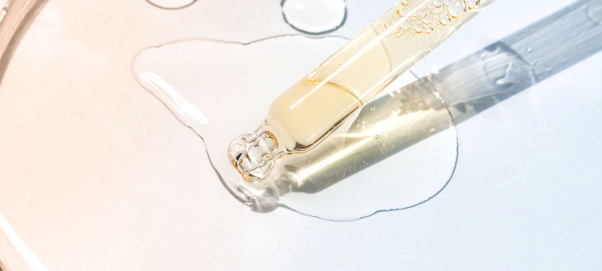 Close-up of natural clean vegan skincare made in france with a dropper on a light background