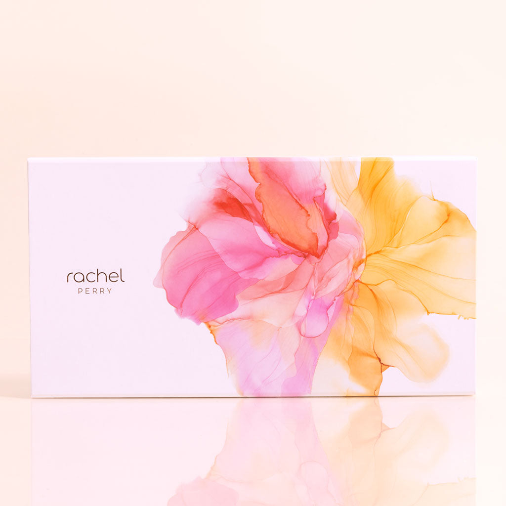 rachel perry discovery ritual gift set box of mini travel sizes with colorful floral design on a light background